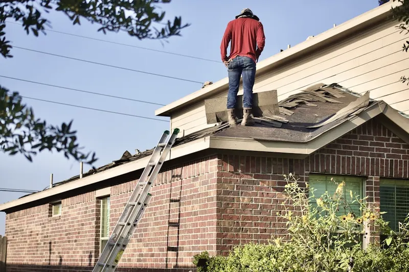 Professional roofer working on a residential roof in Palm Springs